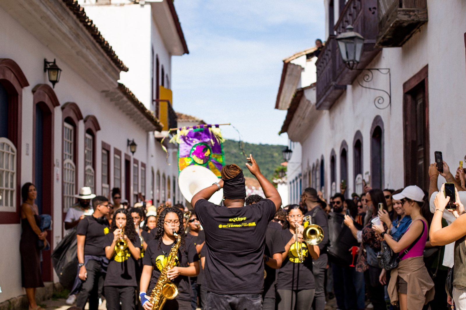 Favela Brass marching through the streets of Paraty